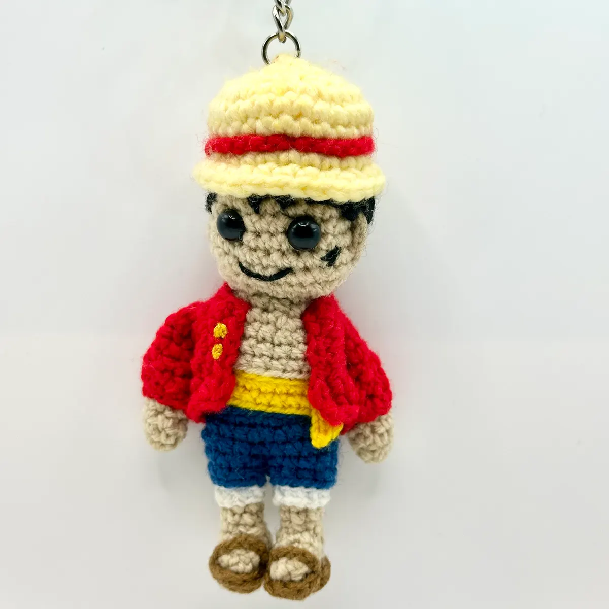 Straw-hat adventurer doll in Red and straw