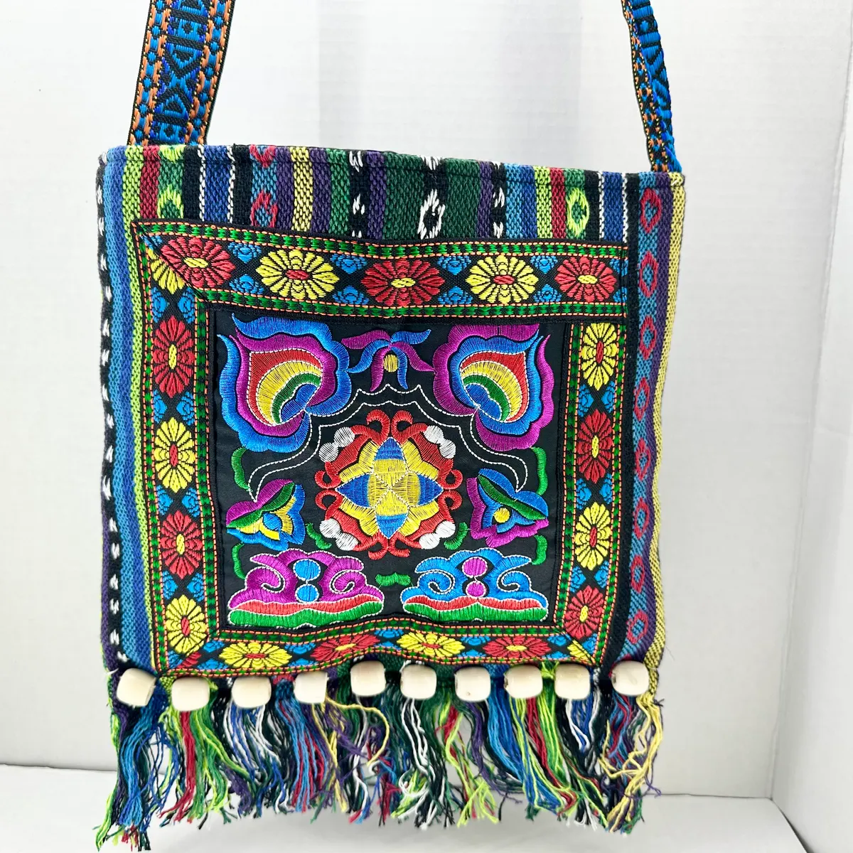 Colorful embroidered crossbody bag with beaded fringe