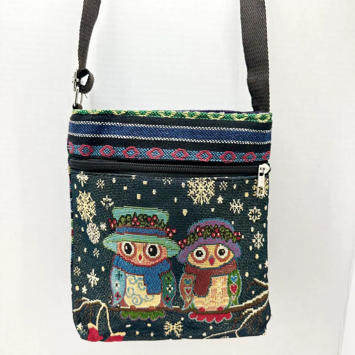 Dark woven crossbody bag with two owls wearing scarves